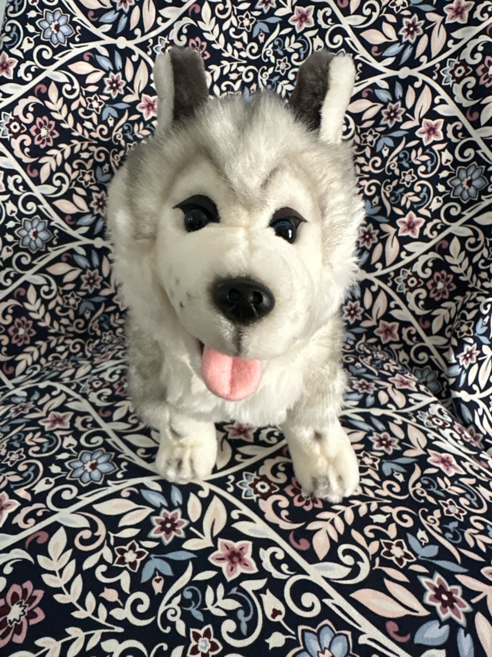 Siberian Husky dog toy with blue eyes and a happy open mouth showing its tongue
